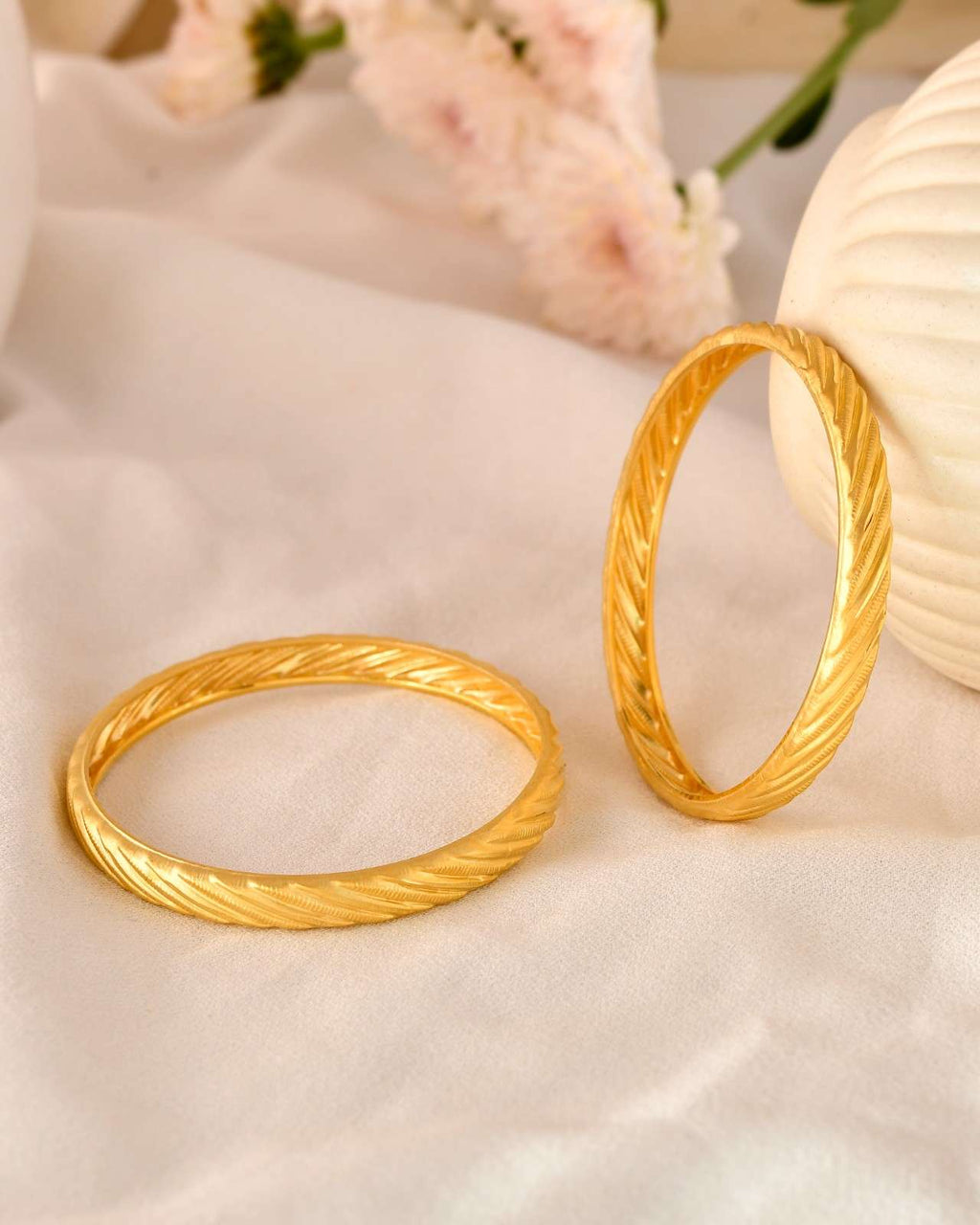 Sleek Dual-Finish Gold-Tone Bangles with Small Floral/Butterfly Embellishments